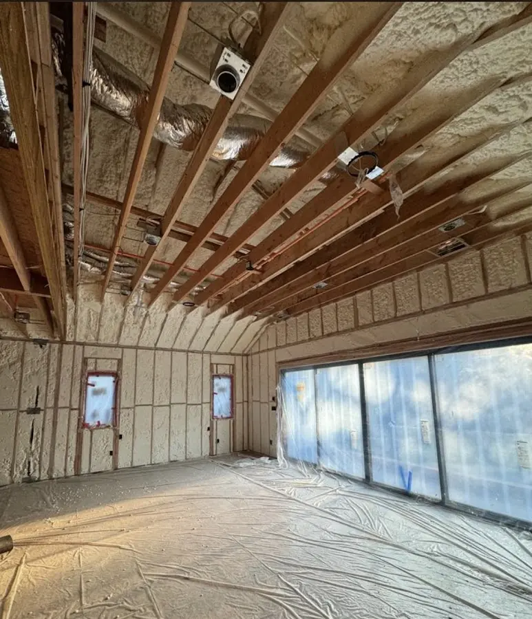 Interior walls and ceiling insulated with spray foam during new construction in West Deptford